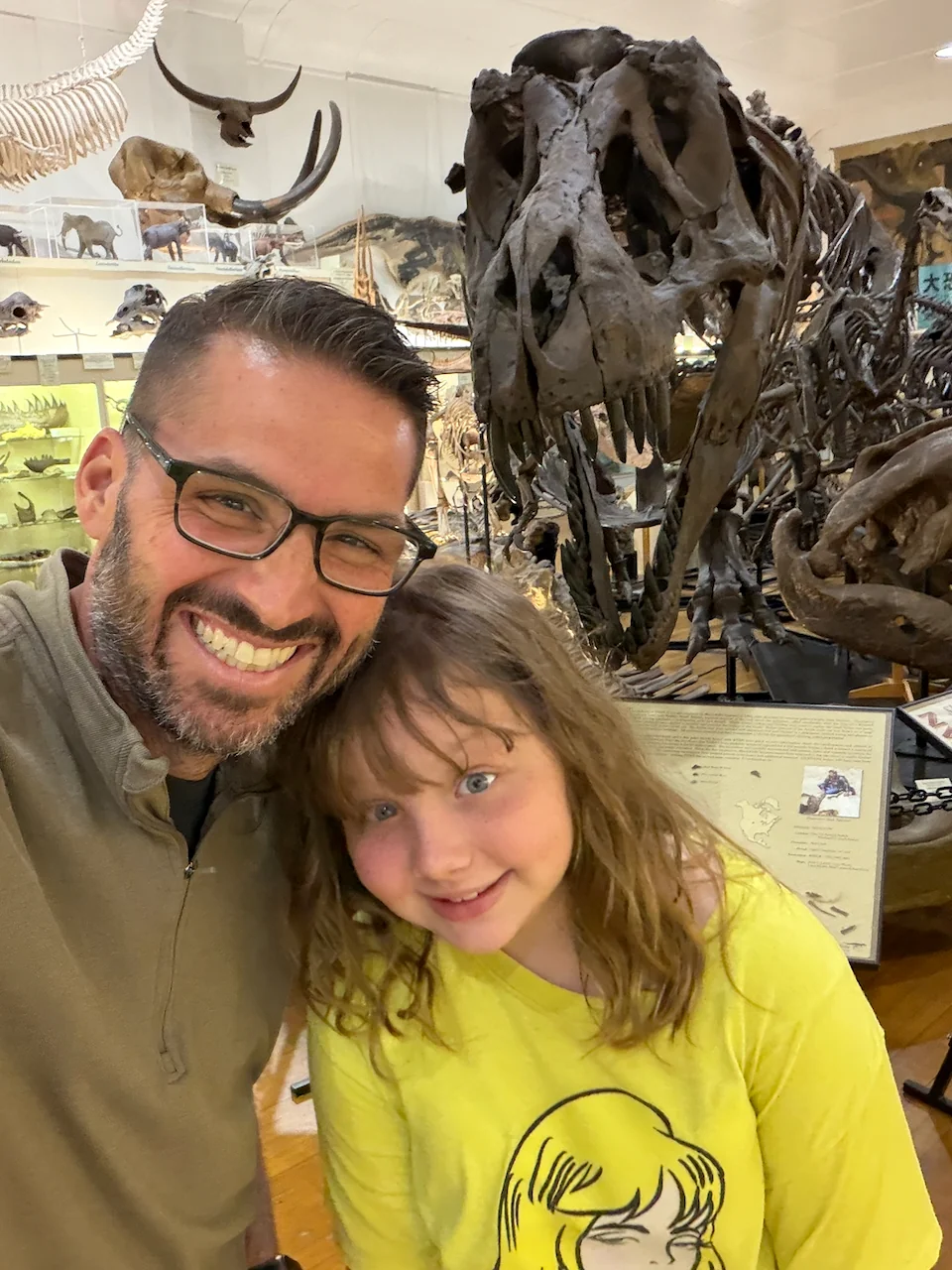 Lily and me with a dinosaur at the Black Hills Institute